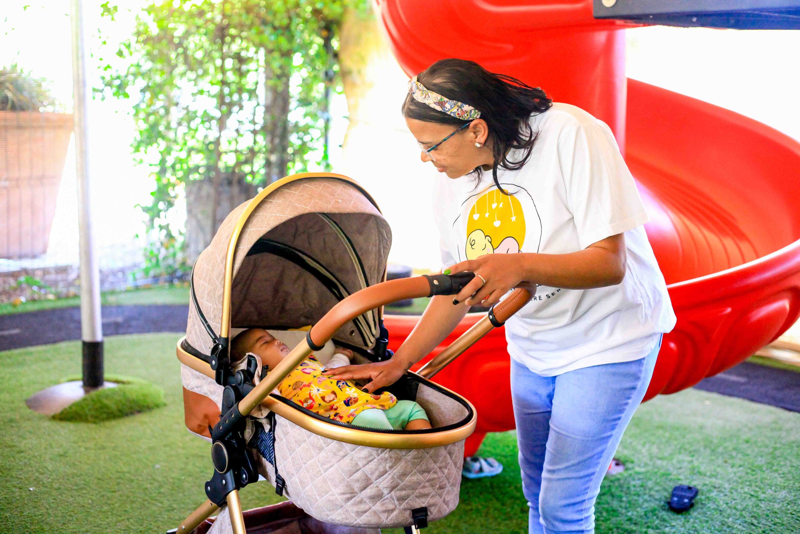 Above & Beyond Nannies nanny putting baby to enjoy sleep in stroller
