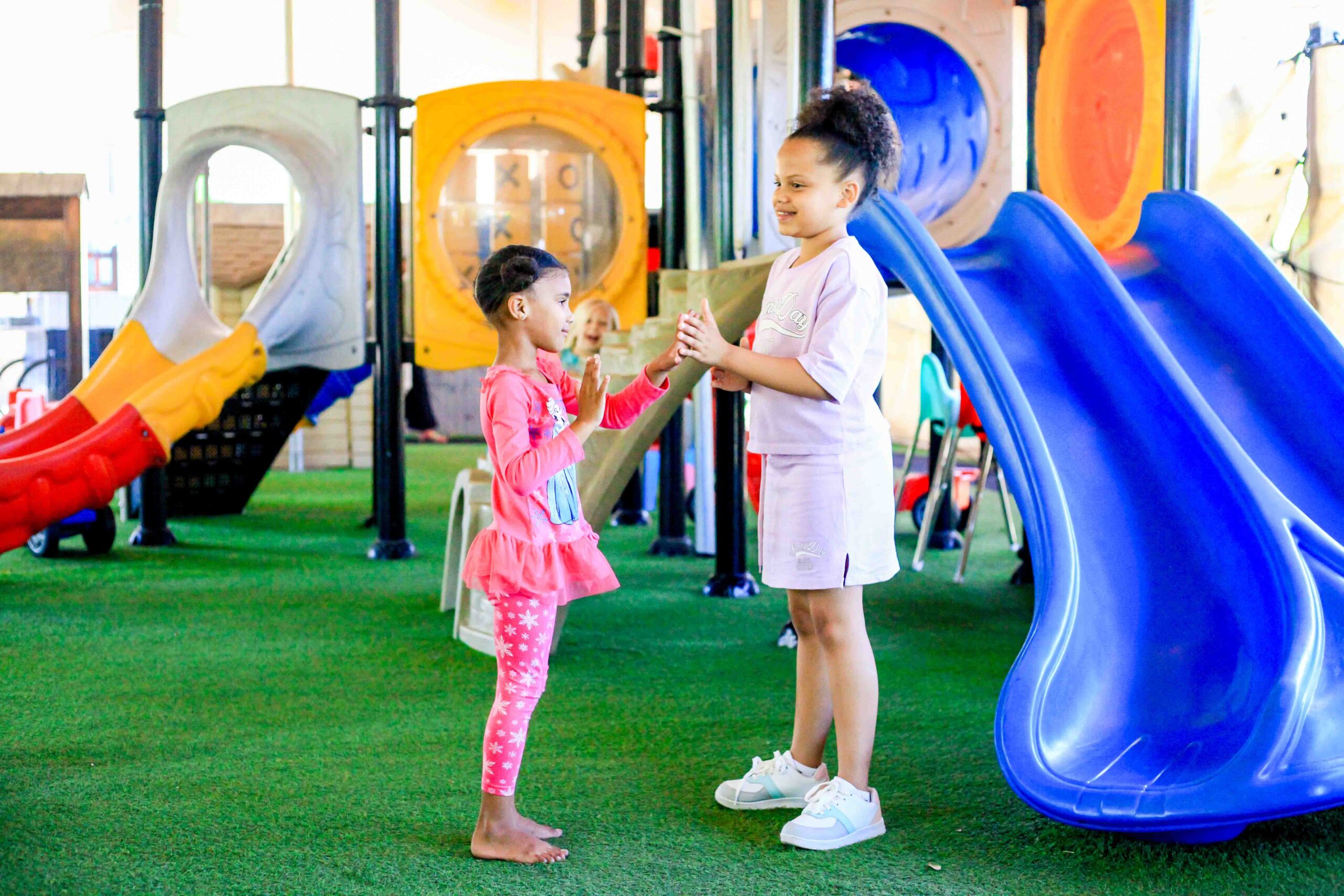 Children playing in playroom with Above & Beyond Nannies